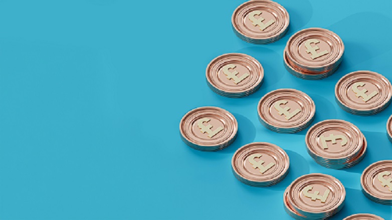 pound coins on blue background