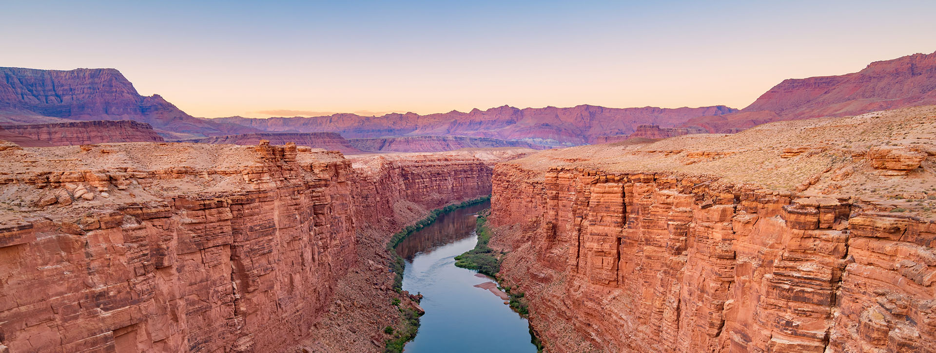 sunrise over a canyon river