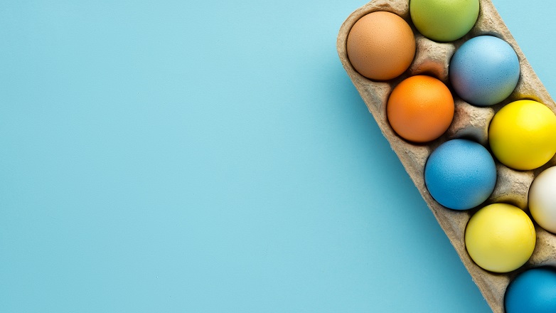 Eggs in basket on blue background