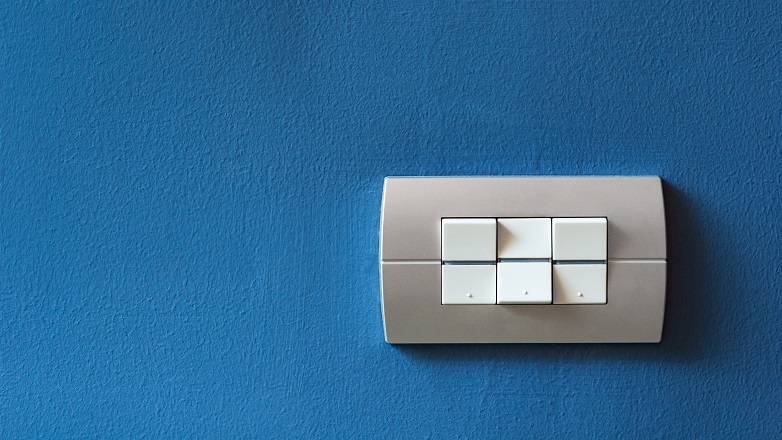 Light switches on a blue wall