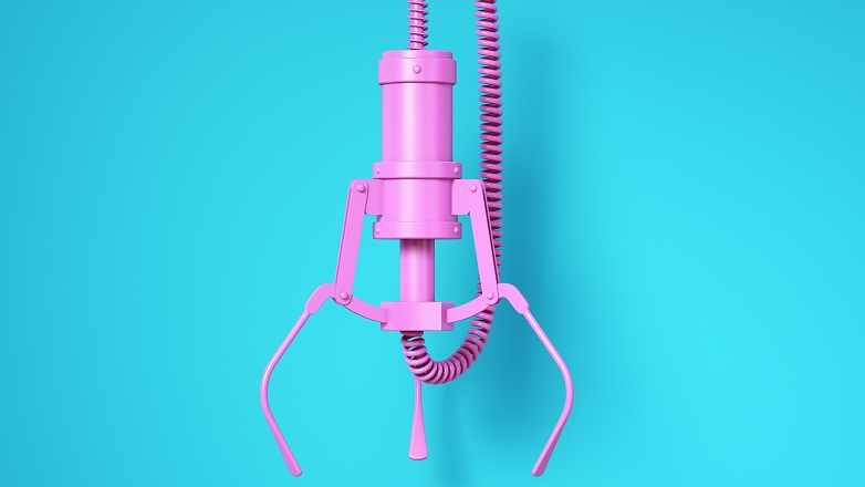 Pink grab machine on blue background